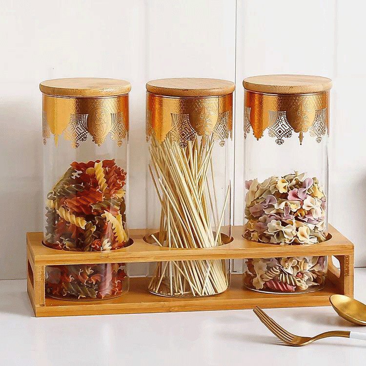 طقم حفظ وتنظيم البقوليات والمكسرات والكاندي 3 قطع زجاج شفاف بنقوش ذهبية مع حامل خشبي