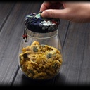 بطرمان 1000ملي بيضاوي بغطاء محكم الغلق مغطي بقماش مزخرف لحمل وتنظيم الكاندي والبلح في المطبخ او علي السفرة