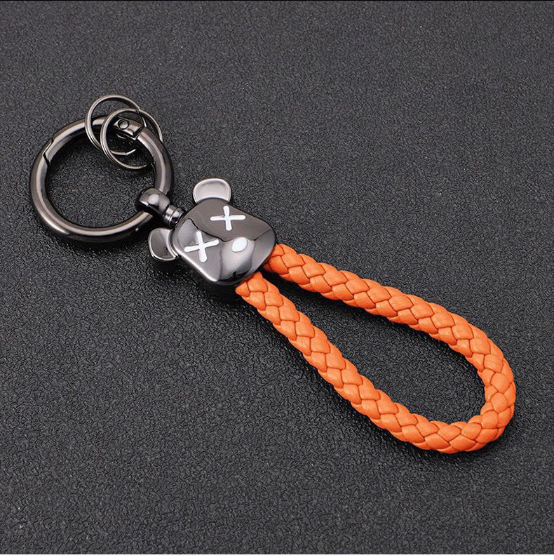 ميدالية من الجلد المضفر برأس دبدوب لمفاتيح السيارات والشنط