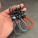 ميدالية من الجلد المضفر برأس دبدوب لمفاتيح السيارات والشنط